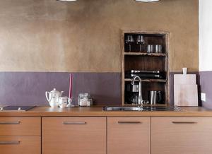 a kitchen with a sink and a counter top at Hof Neuhaus Laugen Alm in Tisens +14 photos