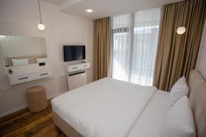 Ένα ή περισσότερα κρεβάτια σε δωμάτιο στο Casa Solis Apartments +17 φωτογραφίες
