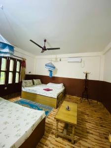 Hotel Tree Land Lodge and Cottage客房内的一张或多张床位