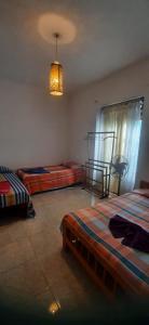 Letto o letti in una camera di Mystique Hideout