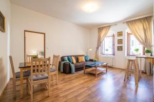 a living room with a couch and a table at Pension Marie in Český Krumlov