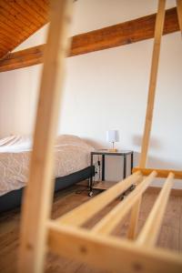 a view of a bedroom with two beds and a table at Gîte la Chapotière proche du Puy du Fou in La Verrie