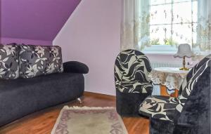 a living room with a couch and a table at 3 Bedroom Gorgeous Home In Jezierzany in Jezierzany +2 photos
