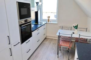 Kuchyň nebo kuchyňský kout v ubytování FeWo Ultima Poel an der Ostsee - ABC367 - nur Feriengäste! + 23 fotografií