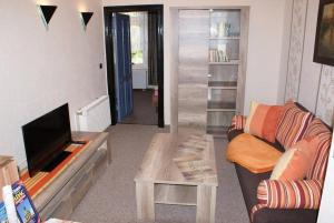 a living room with a couch and a table at Altstadtappartement - ABC59 in Wismar