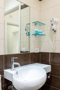 a bathroom with a sink and a mirror at Maison Trevi in Rome +26 photos