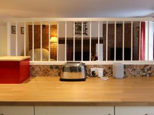 a toaster sitting on top of a kitchen counter at Hollyhocks Cottage in Docking
