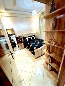 a bedroom with a bed and a fireplace at Afalux Brand chic in Agadir