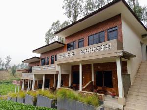 a house with a staircase in front of it at Ikiikahomestay in Probolinggo
