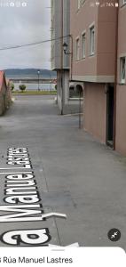 a street with a sign that says ra ra market estates at O nido do cuco in Muxia