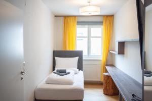 Postel nebo postele na pokoji v ubytování Apartments am Kalvarienberg
