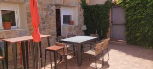 a table and chairs sitting on a patio at Luna de Borobia in Borobia