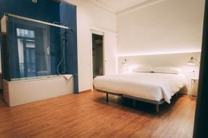 Postel nebo postele na pokoji v ubytování Ramblas Apartments