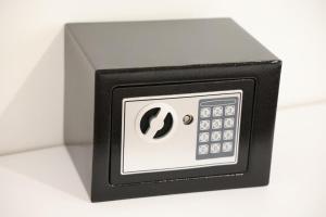 a black and white object with a remote control at A&K Apartments in Sarandë