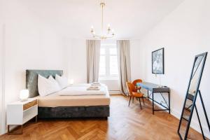 Ένα ή περισσότερα κρεβάτια σε δωμάτιο στο Elegante Altbauwohnung Bregenz am See