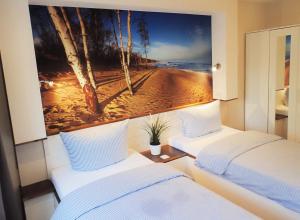 Ein Bett oder Betten in einem Zimmer der Unterkunft Strandfeeling