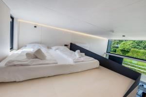 Posteľ alebo postele v izbe v ubytovaní KODA LOFT - Urlaub im Tiny House Bodensee