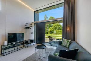 Televízia a/alebo spoločenská miestnosť v ubytovaní KODA LOFT - Urlaub im Tiny House Bodensee