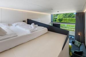 Posteľ alebo postele v izbe v ubytovaní KODA LOFT - Urlaub im Tiny House Bodensee