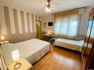 Postel nebo postele na pokoji v ubytování Hotel Volta