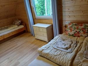 Posteľ alebo postele v izbe v ubytovaní OSTOJA Ślesin