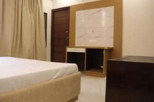 Voodi või voodid majutusasutuse Nirmal Bhawan toas