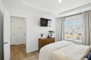 Ένα ή περισσότερα κρεβάτια σε δωμάτιο στο Discovery Point Getaway townhouse +17 φωτογραφίες