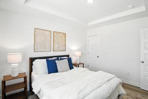 Ένα ή περισσότερα κρεβάτια σε δωμάτιο στο Discovery Point Getaway townhouse