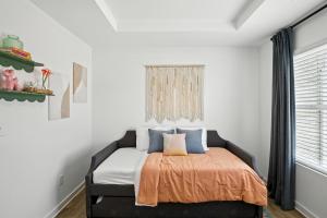 Ένα ή περισσότερα κρεβάτια σε δωμάτιο στο Discovery Point Getaway townhouse