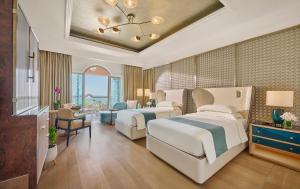 Voodi või voodid majutusasutuse Emirates Palace Mandarin Oriental, Abu Dhabi toas