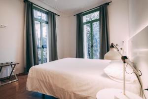 Postel nebo postele na pokoji v ubytování Ramblas Apartments