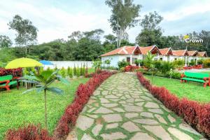 a walkway in front of a resort at Coorg Crown Palace Resort kushalnagar in Jāmb