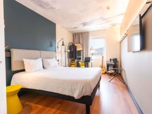 Posteľ alebo postele v izbe v ubytovaní Ibis Malaga Centro Ciudad