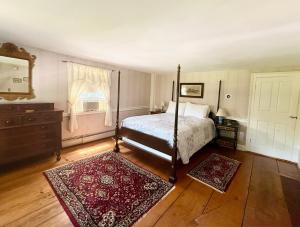 Ένα ή περισσότερα κρεβάτια σε δωμάτιο στο Colonel Spencer Inn