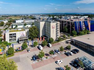 an aerial view of a city with a parking lot at ibis Stuttgart Airport Messe in Leinfelden-Echterdingen