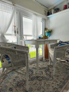 a room with a table and chairs and a window at Bardolino Blue in Bardolino