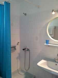 a bathroom with a shower and a sink at Katerina Studios in Paleokastritsa