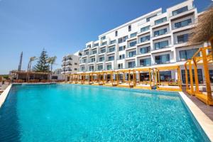 a large swimming pool in front of a building at Saranda Seaview Spot in Sarandë