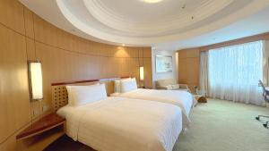 Makati Shangri-La, Manila客房内的一张或多张床位