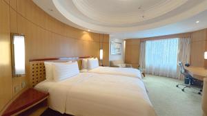 Makati Shangri-La, Manila客房内的一张或多张床位