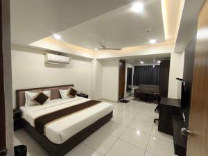 Postel nebo postele na pokoji v ubytování Hotel Shree Ji