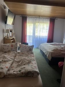 Postel nebo postele na pokoji v ubytování Hotel Eulenhof