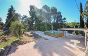a backyard with a swimming pool and a house at Cozy Home In Ceglie Messapica in Ceglie Messapica