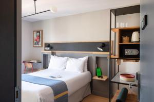Cama ou camas em um quarto em Hotel Brummell