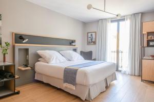 Cama ou camas em um quarto em Hotel Brummell