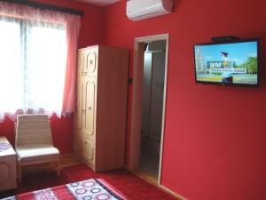 Et tv og/eller underholdning på VUCA medencés, klimatizált Apartmanház