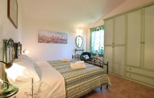 a bedroom with a bed and a clock on the wall at 2 Bedroom Stunning Home In Casacastalda in Casa Castalda