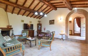 a living room filled with furniture and a fireplace at 2 Bedroom Stunning Home In Casacastalda in Casa Castalda