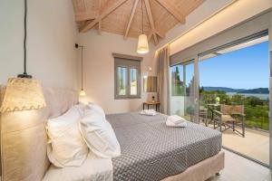 Postel nebo postele na pokoji v ubytování Villa Corelli by Villa Plus + 19 fotografií