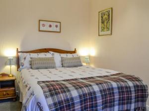 Ένα ή περισσότερα κρεβάτια σε δωμάτιο στο Elnagar Cottage